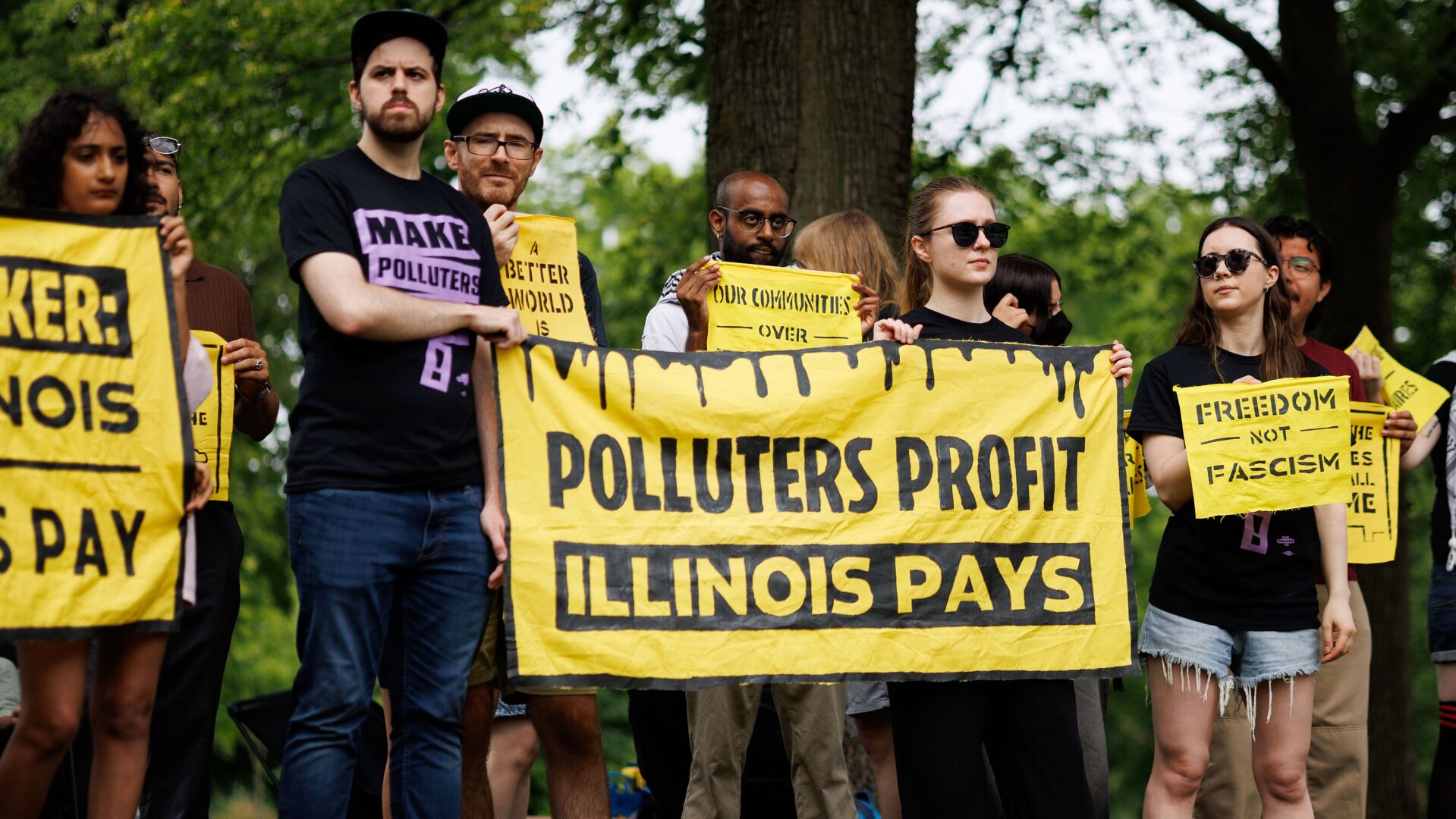 People attend a “Make Polluters Pay” rally
